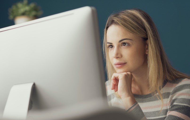 woman looking at laptop