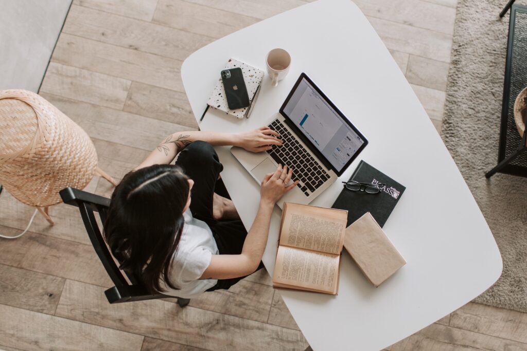 woman typing on laptop