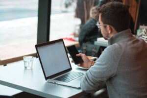man looking at laptop